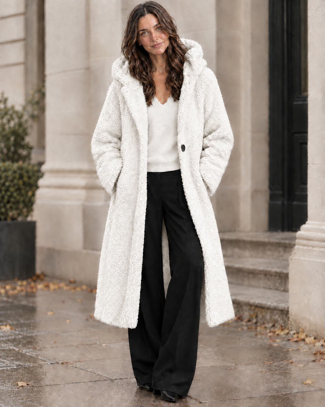 The Alessia Long Coat styled with ivory knit and black wide-leg trousers